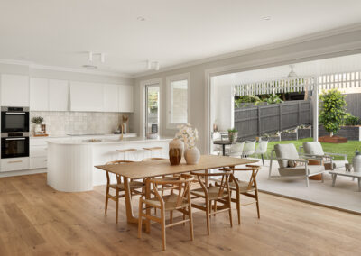 Modern white kitchen with a curved island, gold fixtures, built-in ovens, and an outdoor BBQ area