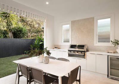 Outdoor entertaining area in Grange connected to kitchen and living spaces with covered alfresco design