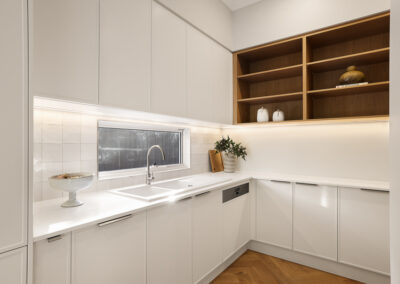 Pantry cabinetry in Grange with white joinery, open timber shelving and integrated storage